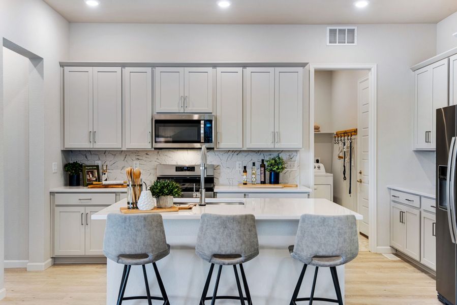 Representative furnished interior of a home built from the 3405 by Tri Pointe Homes in Westside Crossing, Berthoud (Image 11).