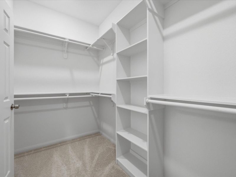 The spacious primary walk-in closet is thoughtfully designed with built-in storage, offering both convenience and everyday ease. The spacious primary walk-in closet is thoughtfully designed with built-in storage, offering both convenience and everyday ease.