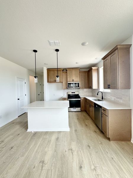 Furnished interior view inside a new home in Sage Hollow, Kyle (Image 6).