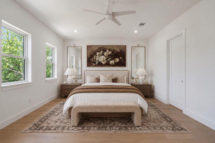 Spacious primary suite with abundant natural light. Virtual staging.