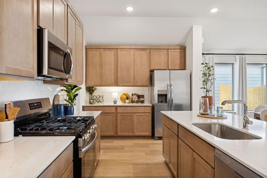 Kitchen in the Diamond home plan by Trophy Signature Homes – REPRESENTATIVE PHOTO