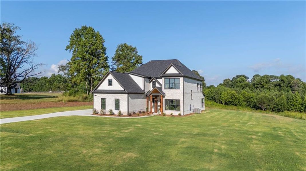 Front exterior of a new home in , Jefferson, GA, highlighting curb appeal (Image 30).