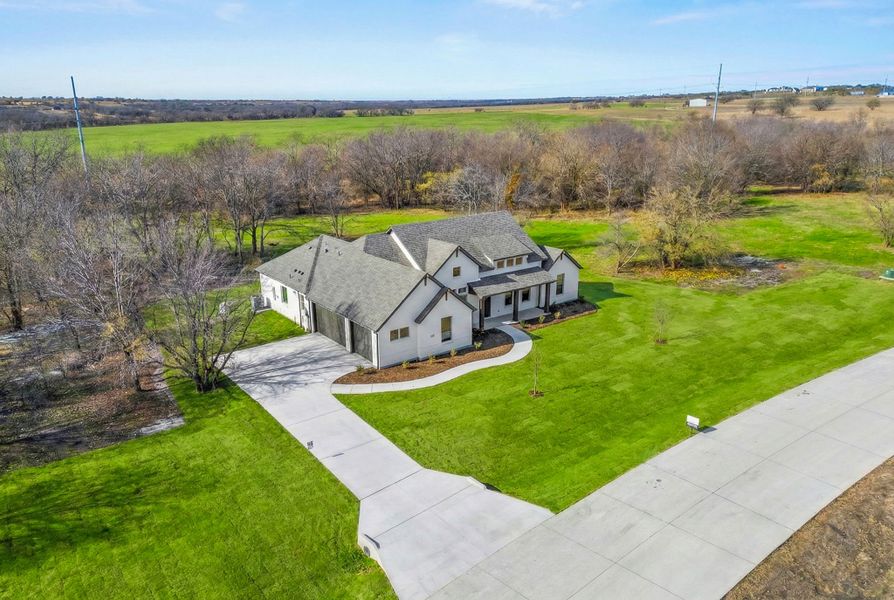 Front exterior of a new home in Rolling Creek Ranch, Aledo, TX, highlighting curb appeal (Image 22).