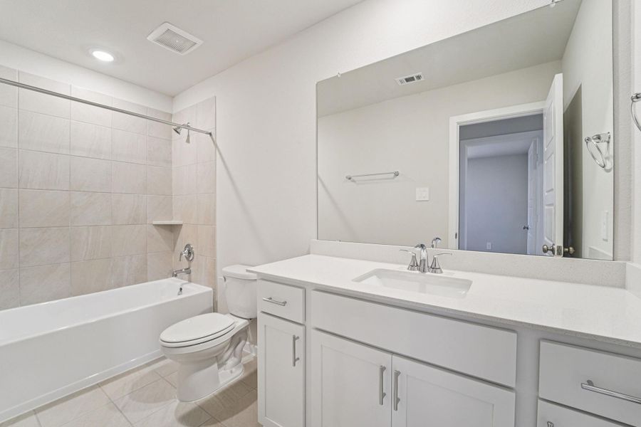 Furnished interior view inside a new home in Granger Pointe - Premier Series, Conroe (Image 14).