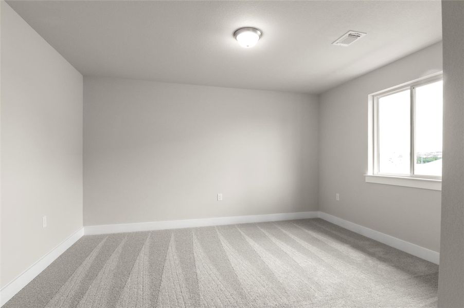 Carpeted empty room with baseboards Carpeted empty room with baseboards