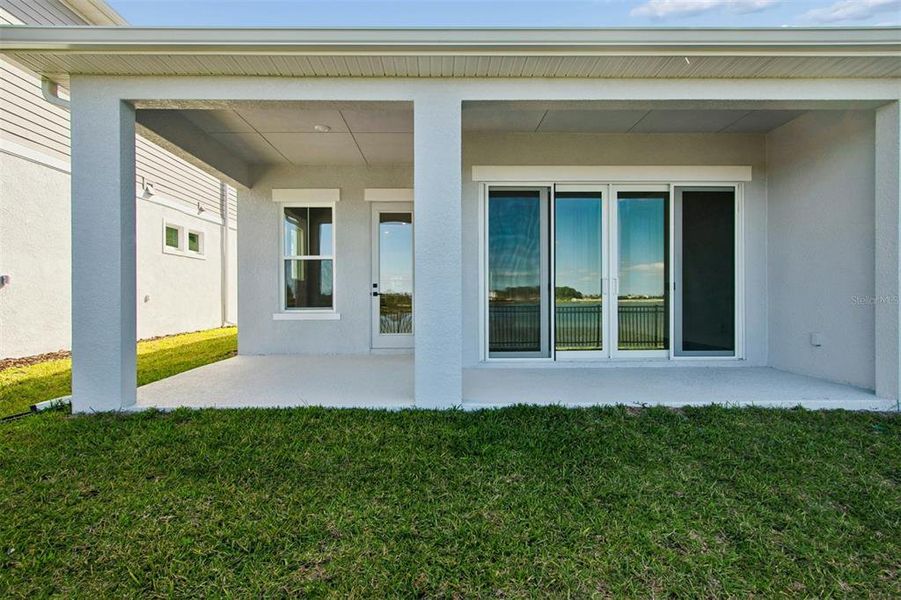 Exterior details and patio area of a home in Emerald Landing at Waterside at Lakewood Ranch – Lake Series, Sarasota (Image 23).