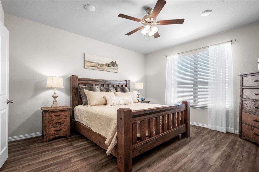 The primary bedroom is a serene retreat, designed with both elegance and comfort!