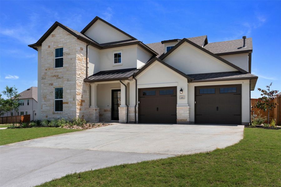 Contemporary two-story exterior featuring stone and stucco finishes