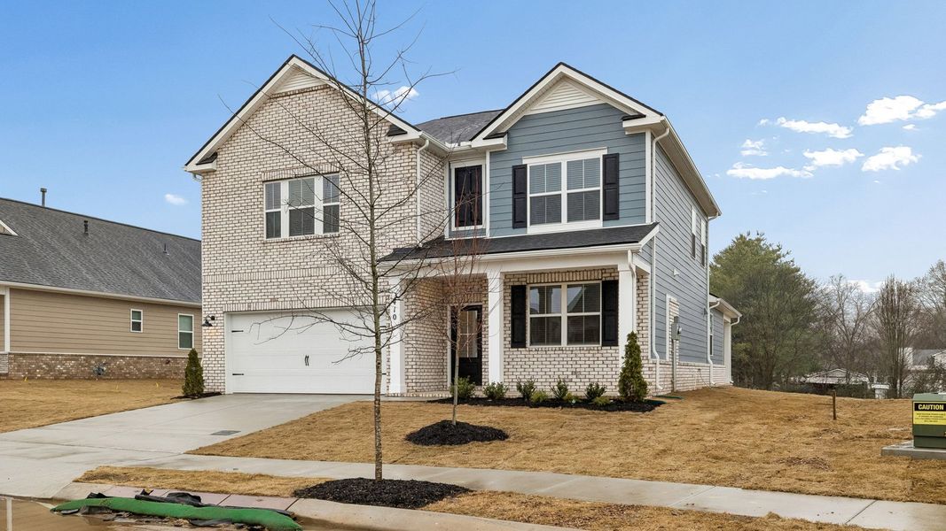 Front exterior of a new home in Harvest Point, Spring Hill, TN, highlighting curb appeal (Image 23).