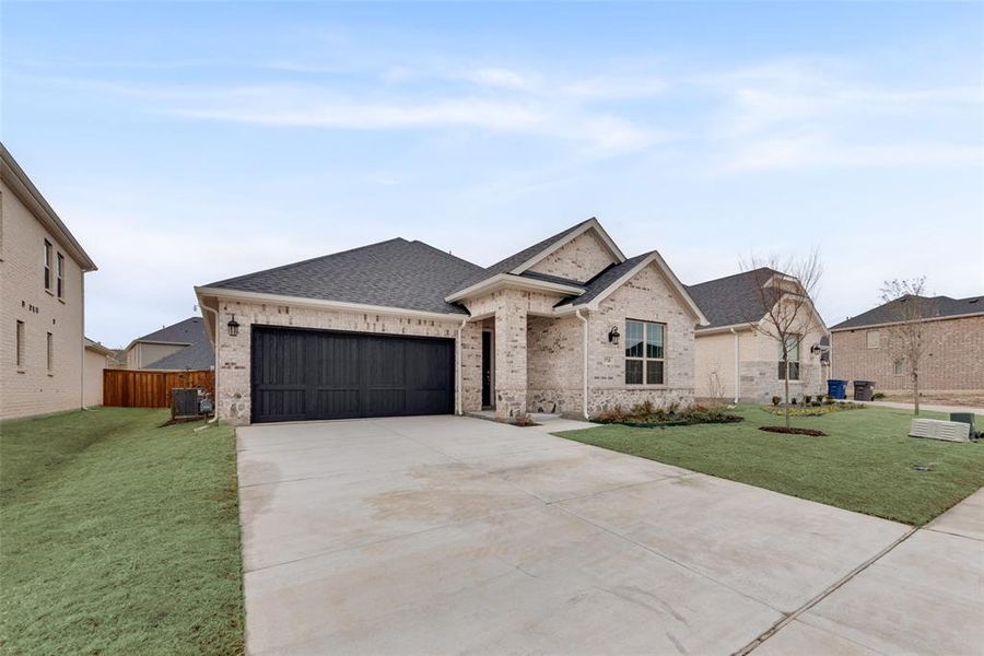 Front exterior of a new home in Sutton Fields, Celina, TX, highlighting curb appeal (Image 22).