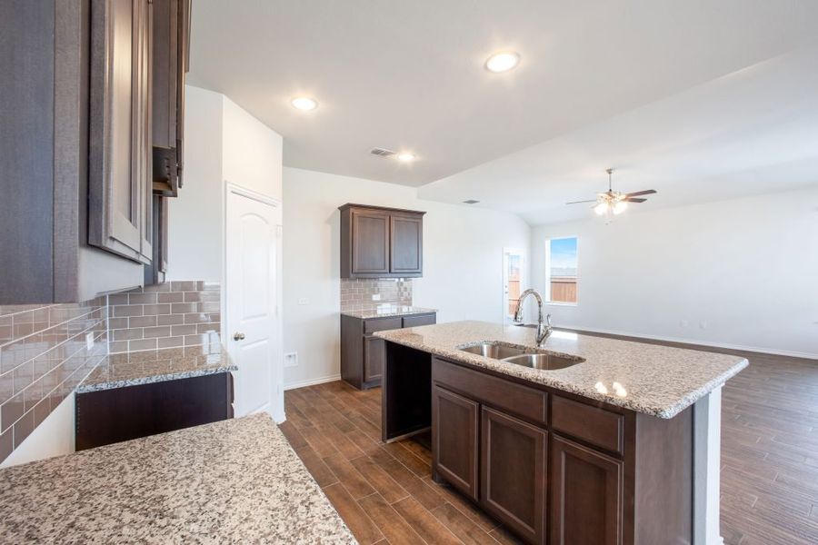 Representative exterior photo of a completed home built from the Wesley by Impression Homes in Heartland, Heartland, TX (Image 7). Representative exterior photo of a completed home built from the Wesley by Impression Homes in Heartland, Heartland, TX (Image 7).