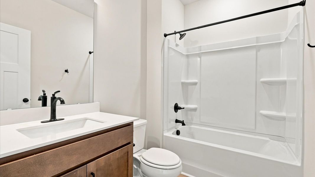 Top-notch bathroom with current fixtures, tasteful materials, and elevated charm near Downtown Clemson