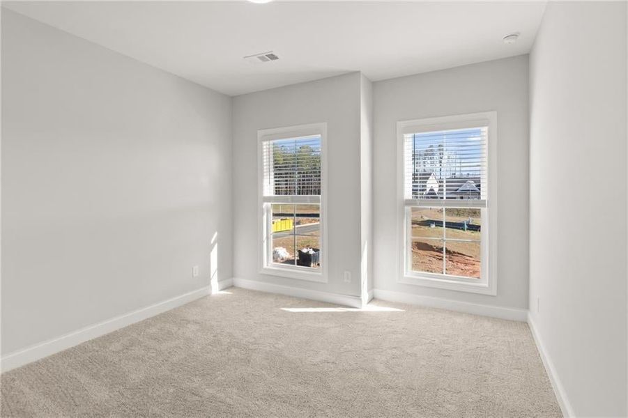 The secondary bedrooms in this beautiful new construction home offer spacious, comfortable retreats for family members or guests. Each room is generously sized, with plenty of natural light streaming through large windows, creating bright and inviting sp