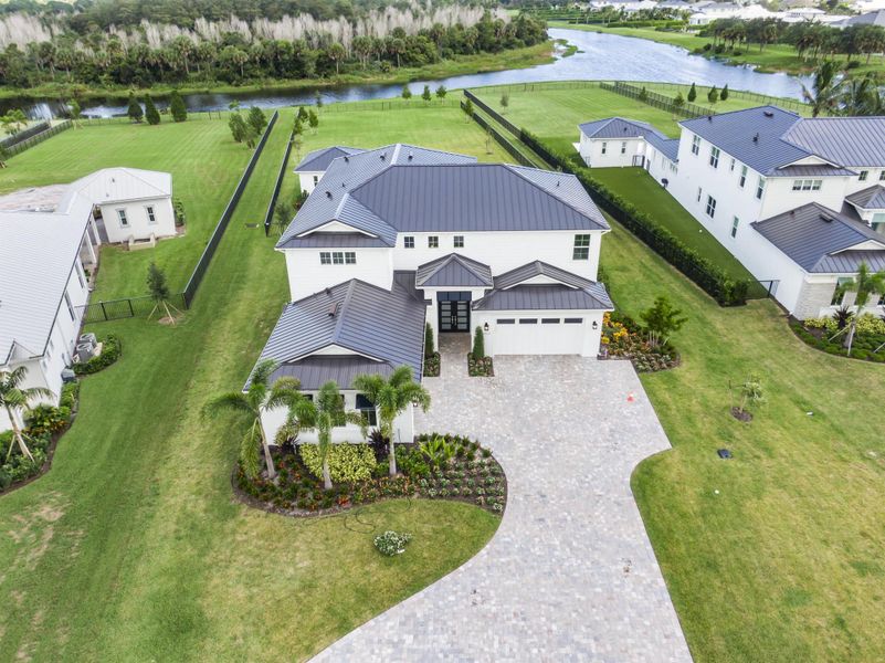 Front exterior of a new home in , Jupiter, FL, highlighting curb appeal (Image 26).