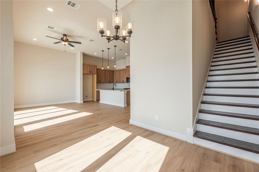 From the dining area, looking toward the kitchen and stairway to 2nd floor