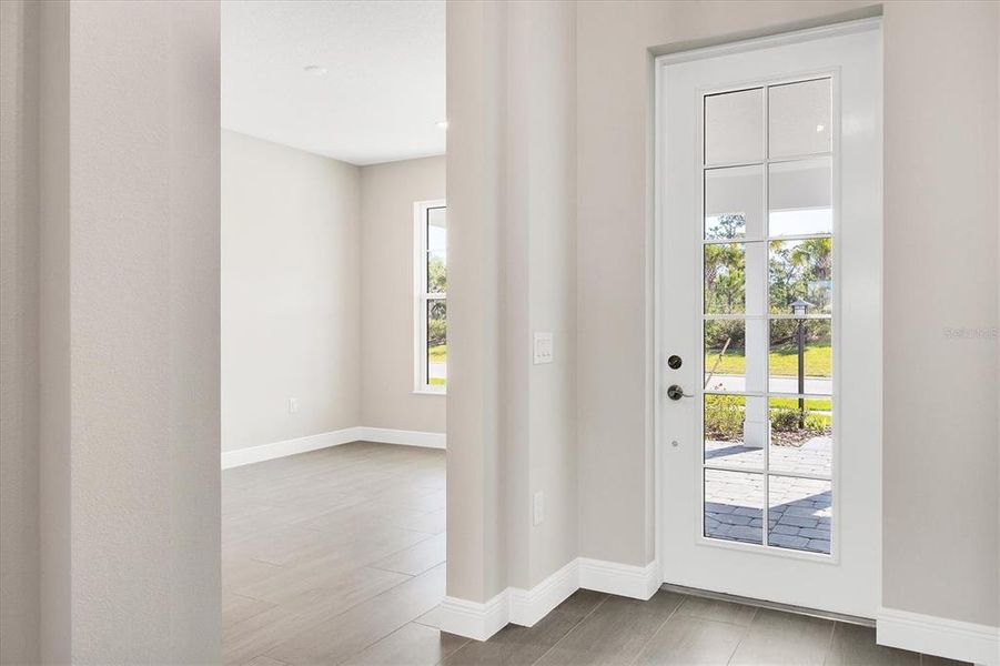 Entry and looking into family room or den