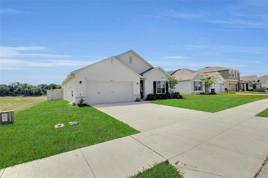 Front exterior of a new home in Autumn Glen, Belleview, FL, highlighting curb appeal (Image 21).