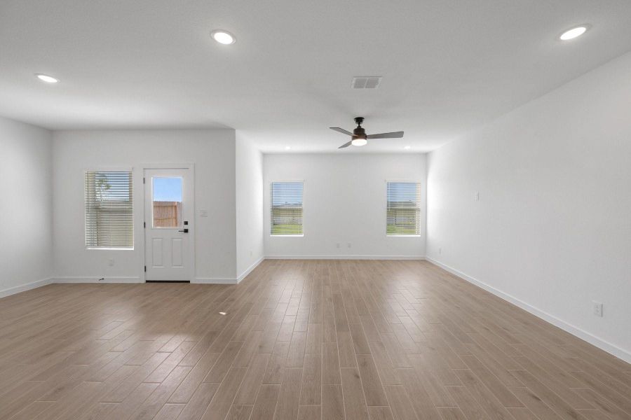 Open great room and dining area (*Photo not of actual home and used for illustration purposes only.)