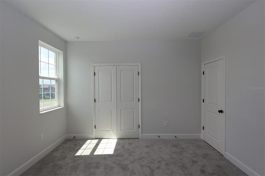 Spacious, unfurnished interior of a new home in Lake Star at Ovation, Winter Garden (Image 28).