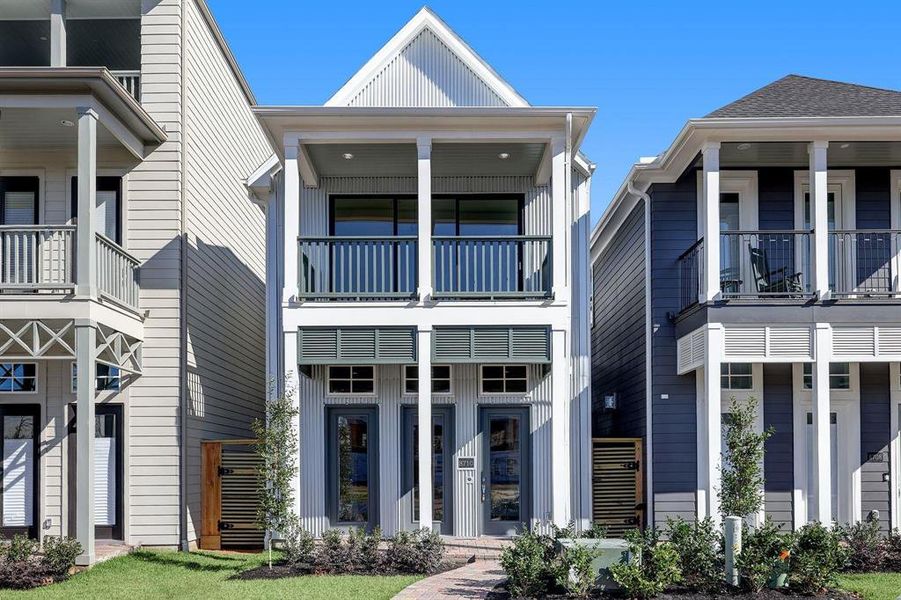 Urban Farmhouse Architecture at its Best. Front Porch and Balcony with Corrugated Metal apart of the Appeal.