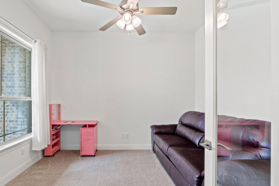 Tucked behind elegant glass-paned French doors, the home features a bright flex room that can adapt to your needs. Whether you require a quiet home office, a cozy library, or a creative studio, this space provides privacy.