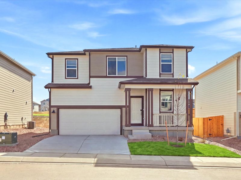 Front exterior of a new home in Lorson Ranch : The Springs Collection, Colorado Springs, CO, highlighting curb appeal (Image 1). Front exterior of a new home in Lorson Ranch : The Springs Collection, Colorado Springs, CO, highlighting curb appeal (Image 1).