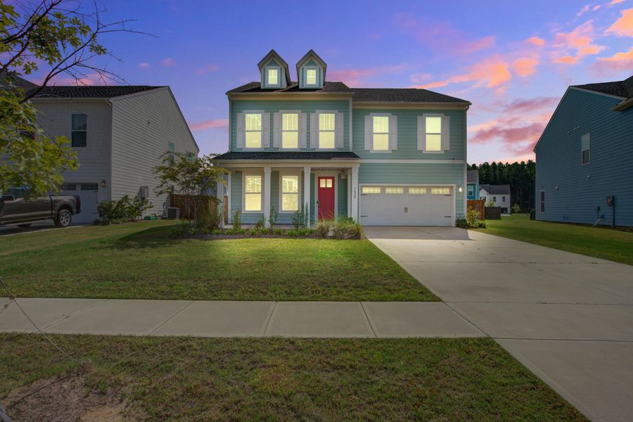 Front exterior of a new home in Homecoming, Ravenel, SC, highlighting curb appeal (Image 30).