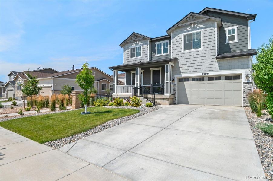 Front exterior of a new home in , Aurora, CO, highlighting curb appeal (Image 23).