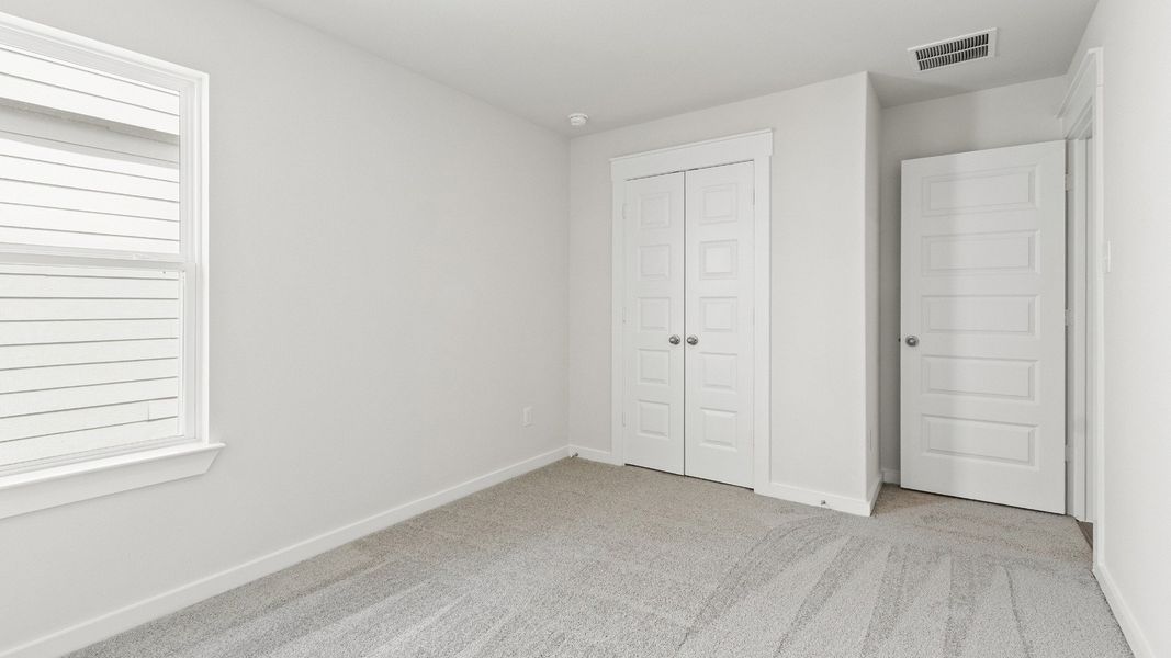 Representative furnished interior of a home built from the Avalon by Brightland Homes in Cielo, Conroe (Image 15).
