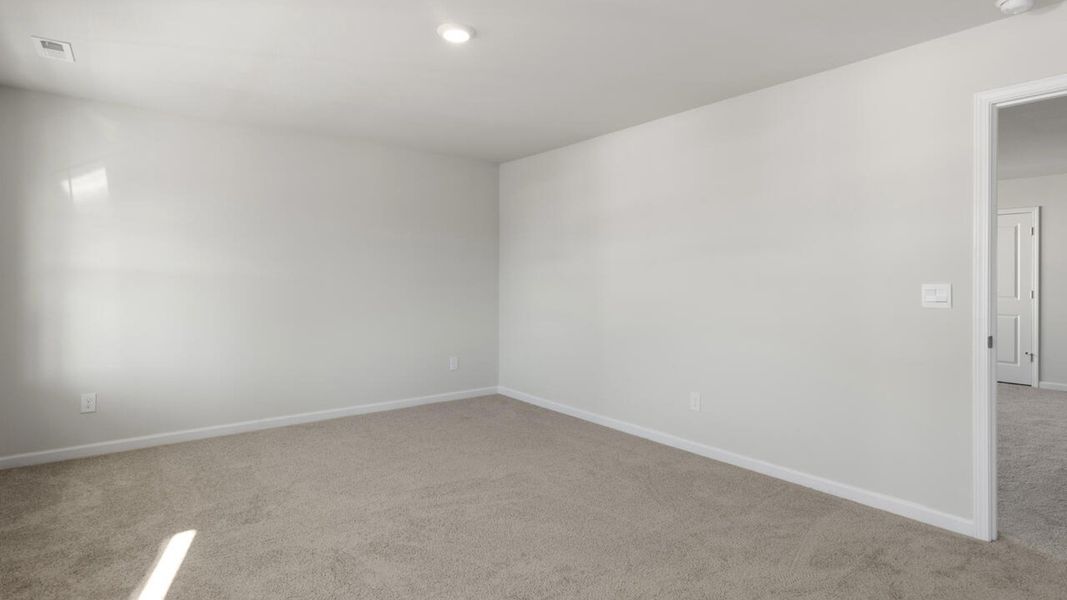 Representative unfurnished interior of a home built from the HARBOR OAK by D.R. Horton in Indigo Preserve, Leland (Image 42).