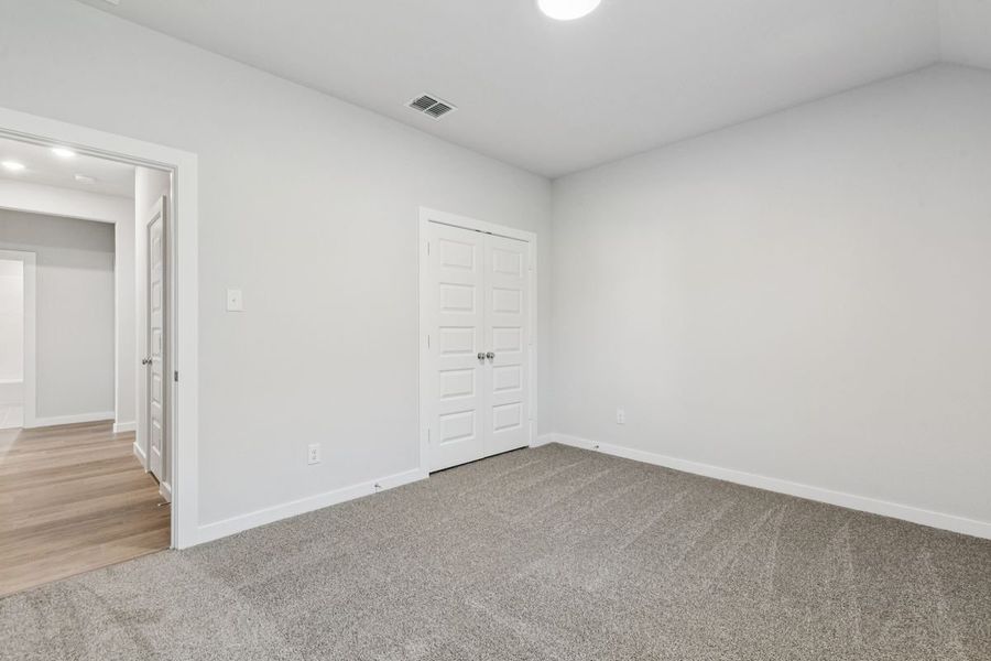 Bedroom in the Oscar home plan by Trophy Signature Homes – REPRESENTATIVE PHOTO Bedroom in the Oscar home plan by Trophy Signature Homes – REPRESENTATIVE PHOTO