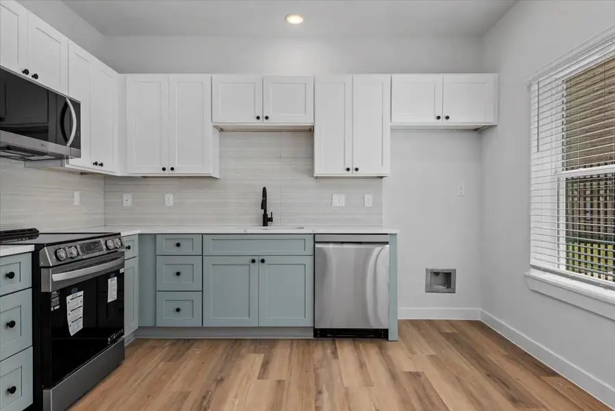 Kitchen features sleek quartz countertops, stainless steel appliances, and a modern layout designed for both style and functionality. Fridge to be added soon. Kitchen features sleek quartz countertops, stainless steel appliances, and a modern layout designed for both style and functionality. Fridge to be added soon.