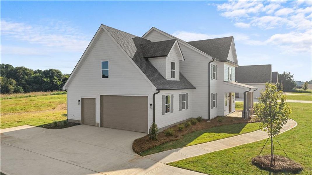 Front exterior of a new home in , Madison, GA, highlighting curb appeal (Image 32). Front exterior of a new home in , Madison, GA, highlighting curb appeal (Image 32).
