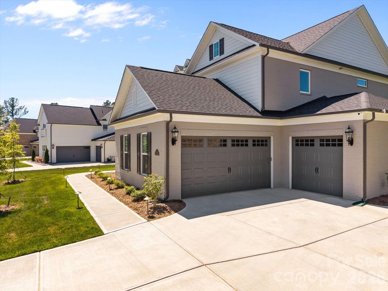 Front exterior of a new home in Olmsted, Huntersville, NC, highlighting curb appeal (Image 25).