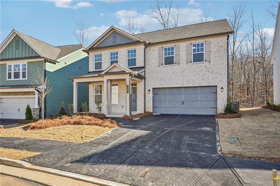Front exterior of a new home in Creekside, Dawsonville, GA, highlighting curb appeal (Image 2). Front exterior of a new home in Creekside, Dawsonville, GA, highlighting curb appeal (Image 2).