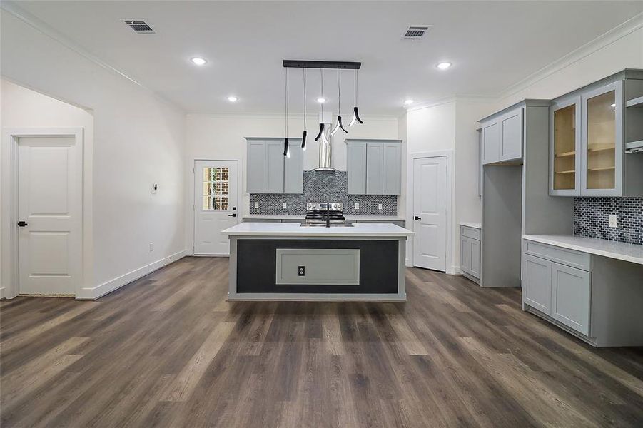 The heart of the home is a chef's kitchen that exceeds expectations with its state-of-the-art appliances, custom cabinetry, and luxurious countertops crafted from quartz.