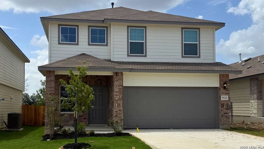 Front exterior of a new home in Stonehill, San Antonio, TX, highlighting curb appeal (Image 1). Front exterior of a new home in Stonehill, San Antonio, TX, highlighting curb appeal (Image 1).
