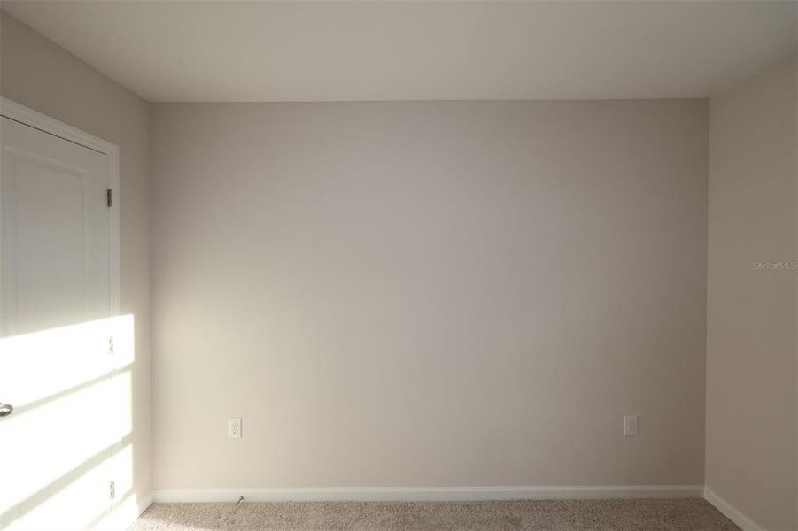 Spacious, unfurnished interior of a new home in Reeves Place, Orlando (Image 12).