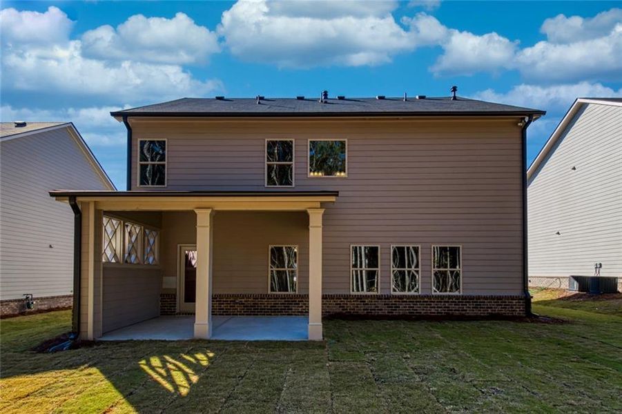 Exterior details and patio area of a home in Enclave at Logan Point, Loganville (Image 2).