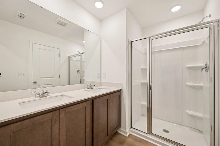 Primary Bath featuring the AW Collection® Roosevelt - Elegant tile and bold hardware finishes.
