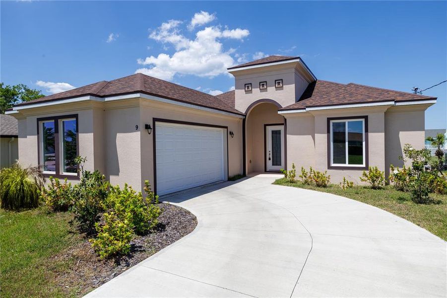 Front exterior of a new home in , Palm Coast, FL, highlighting curb appeal (Image 22).