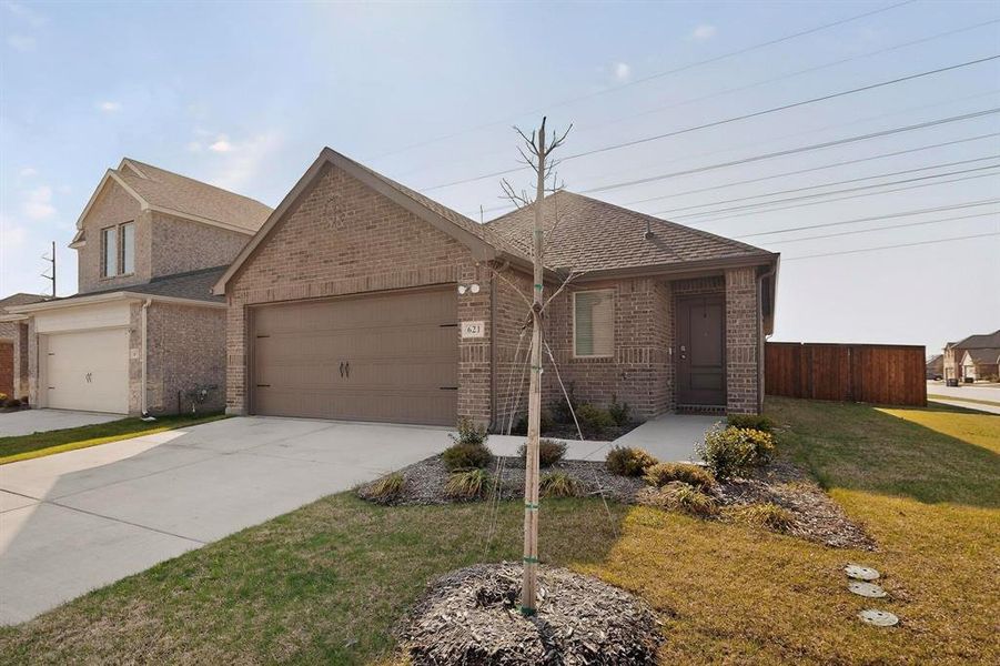 Front exterior of a new home in , Lavon, TX, highlighting curb appeal (Image 21). Front exterior of a new home in , Lavon, TX, highlighting curb appeal (Image 21).