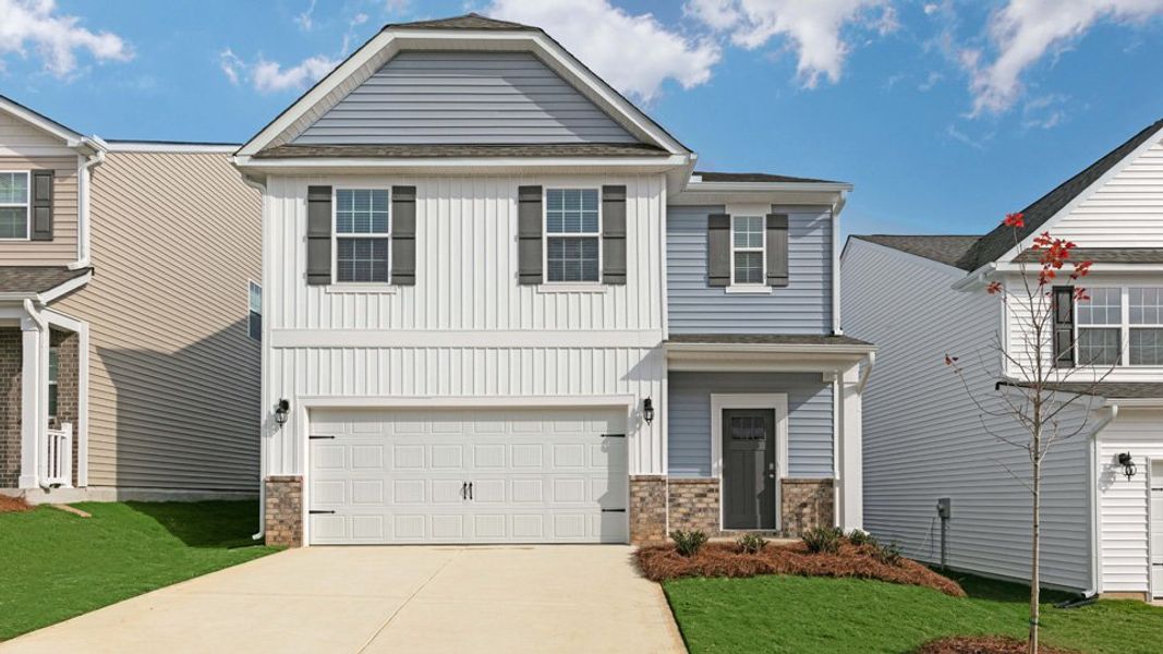 Front exterior of a new home in The Grove at Matthews Landing, Fuquay Varina, NC, highlighting curb appeal (Image 1). Front exterior of a new home in The Grove at Matthews Landing, Fuquay Varina, NC, highlighting curb appeal (Image 1).