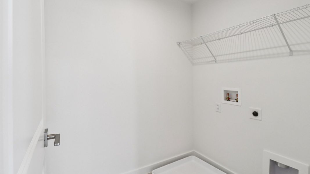 Laundry Room in the Monterey End Townhome by DRB Homes - Cyrene at Harmony in St Cloud FL