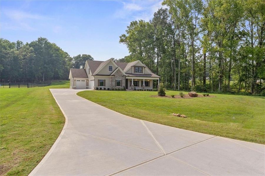 Front exterior of a new home in , Covington, GA, highlighting curb appeal (Image 24).