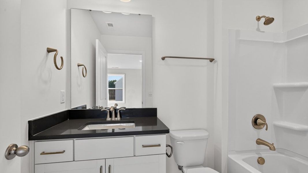 Representative furnished interior of a home built from the Hartwell by D.R. Horton in The Estates Park, Apex (Image 8).