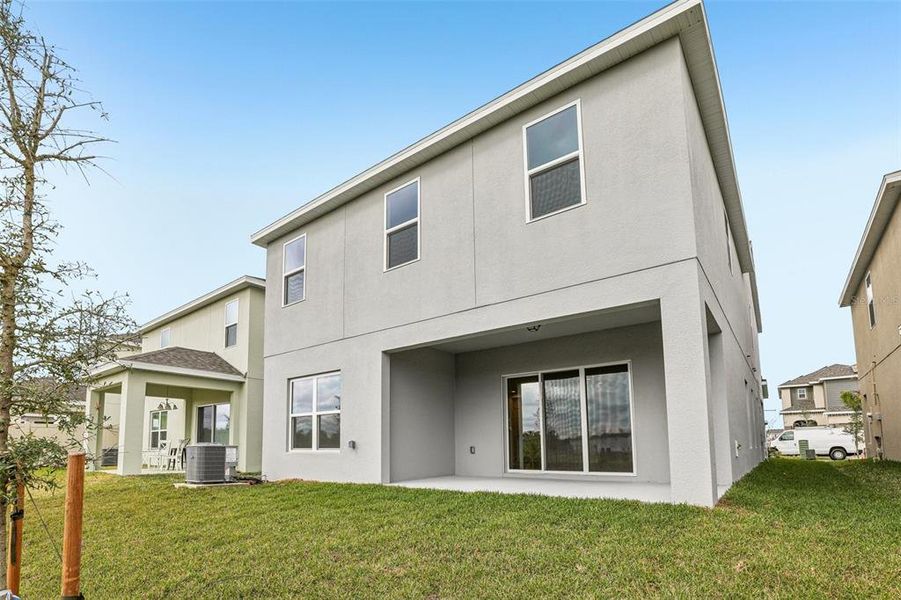 Exterior details and patio area of a home in Preservation Pointe, Davenport (Image 3).