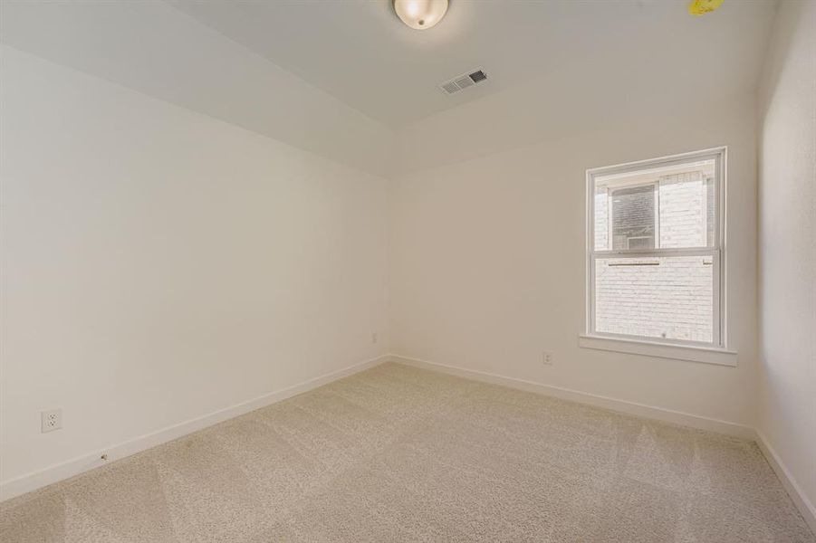 Unfurnished room featuring baseboards and carpet floors