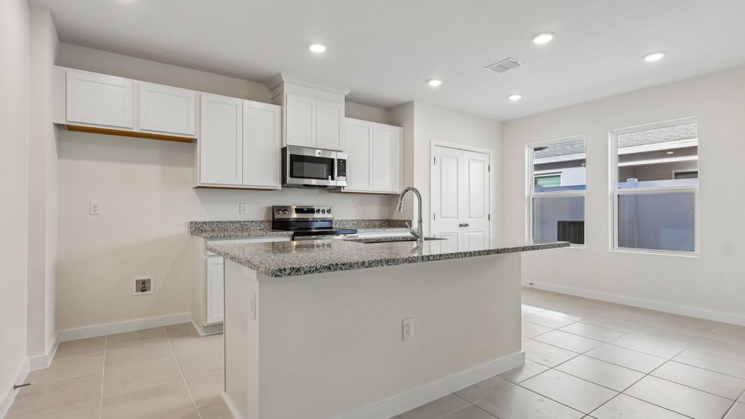 Furnished interior view inside a new home in Cyrene at Harmony, St. Cloud (Image 12).