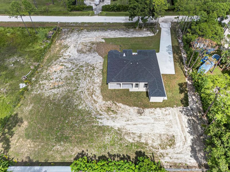 Front exterior of a new home in , The Acreage, FL, highlighting curb appeal (Image 2). Front exterior of a new home in , The Acreage, FL, highlighting curb appeal (Image 2).